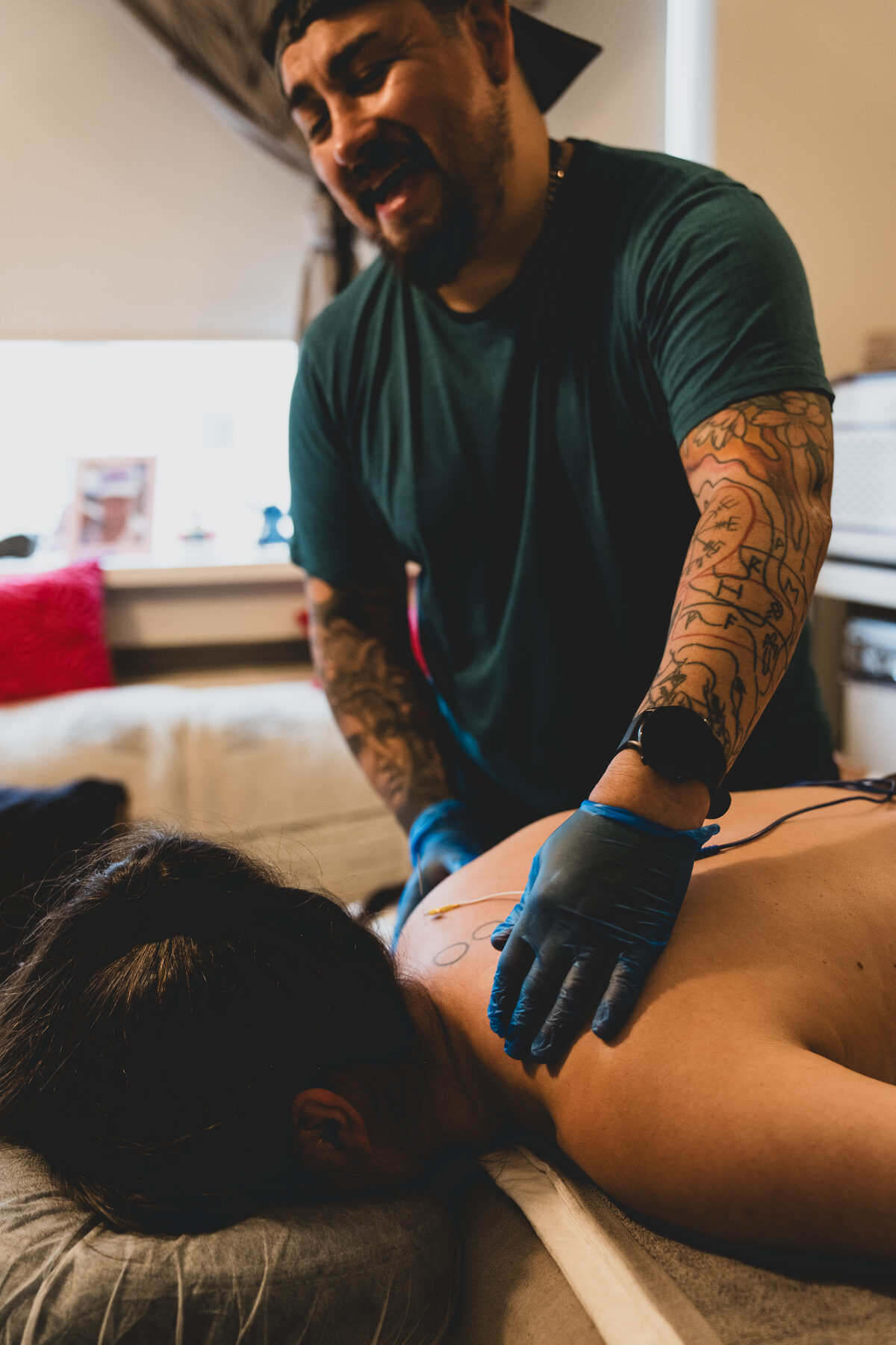 A therapist placing glass cups during a massage session